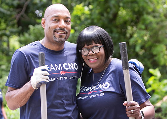 CNO associates volunteering outdoors