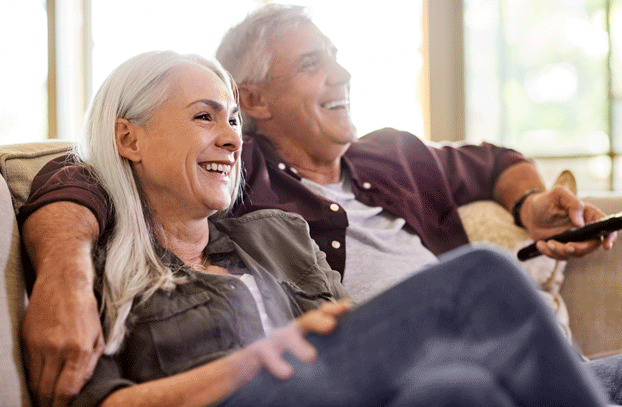 man and woman together on couch