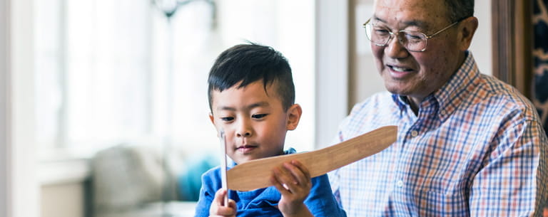 grandfather and grandson with toy airplane